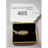 A FIVE STONE DIAMOND RING, on an 18 ct yellow gold shank, ring size O