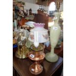 AN ANNIVERSARY CLOCK under a glass dome and a collection of table lamps