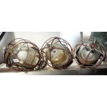 THREE VINTAGE INDUSTRIAL LIGHTS, with cast aluminium bodies and wire covered domed glass shades,