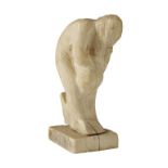 AGATHA WALKER (1888-1980): A CARVED IVORY SCULPTURE modelled as a naked woman, 15cm high, circa