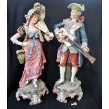 A LARGE PAIR OF 19TH CENTURY CONTINENTAL FIGURES, a musician playing a guitar and a lady with a fan,