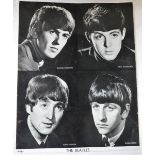 THE BEATLES; A BLACK AND WHITE PHOTOGRAPH OF ALL FOUR BEATLES, signed in blue pen by George