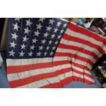 A LARGE 19TH CENTURY AMERICAN "STARS & STRIPES" FLAG, with 36 printed stars, circa 1865-67, cut into