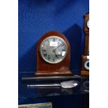 AN EDWARDIAN MAHOGANY CASED MANTEL CLOCK a mother of pearl spoon with a metal handle and an ebony