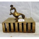 A BRASS BOXED RATTLE BELL, the interior with brass balls, the handle of exotic bird form