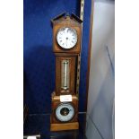 A LATE VICTORIAN CLOCK in the form of a miniature longcase clock, with a rosewood and fan inlaid