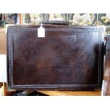 A VINTAGE DARK BROWN LEATHER BRIEFCASE WITH GOLD COLOURED HARDWARE