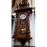 A LATE VICTORIAN WALNUT CASED WALL CLOCK, 96cm high (working and striking)