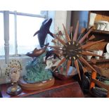 A 1970'S STAR BURST TEAK CLOCK, a bronze dolphin study and similar items