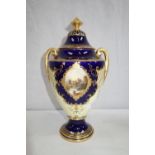 A COALPORT LIDDED VASE, with Royal blue and gilt decoration, 26 cm high (examine)