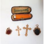 A BOXED CHEROOT HOLDER with 9ct gold cuff, two 9ct gold crosses and two 9ct gold seals, as lotted