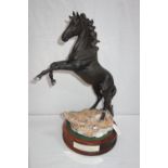 BESWICK; "THE BLACK HORSE CANCARA" on a wooden base