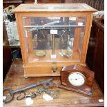 A SET OF SCIENTIFIC SCALES in a glazed case, a mantel clock and a collection of keys