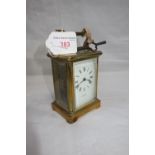 A BRASS CASED CARRIAGE CLOCK, retailed by Chapman, Chelmsford (with key)