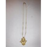 A GOLD AND CULTURED PEARL NECKLACE, the gold bear shaped pendant with clear paste collar and