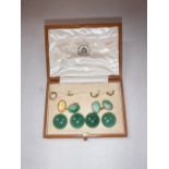 A CASED SET OF 18CT YELLOW GOLD AND JADE CUFFLINKS AND DRESS STUDS, the cufflinks each set with oval