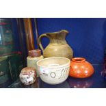 A STUDIO POTTERY JUG a squat orange glazed studio pottery vase and similar ceramics