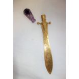 A 19TH CENTURY LETTER OPENER, the yellow metal blade with engraved scroll and foliate decoration,