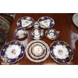 A COLLECTION OF 19TH CENTURY TEAWARES decorated in Royal blue and gilt, with botanical specimens