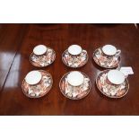 A SET OF SIX ROYAL CROWN DERBY COFFEE CANS with saucers in the Imari style