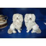 A PAIR OF 19TH CENTURY STAFFORDSHIRE POODLES circa 1835, 14 cm high (with receipt from 1978)