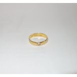 A 22CT YELLOW GOLD WEDDING RING, set with a diamond (tested), weight 3.4gm