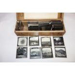 A COLLECTION OF LATE 19TH CENTURY BLACK AND WHITE MAGIC LANTERN SLIDES, to include scenes of