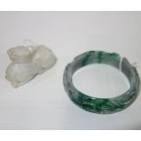 A JADE BRACELET, decorated with a mythical bird between foliage, and a white mythical beast (2)