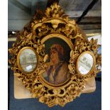 A PAIR OF CARVED AND GILT OVAL FLORENTINE FRAMES containing oil on board portrai