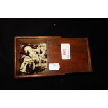 A 19TH CENTURY RED AND WHITE BONE CHESS SET (SOME DAMAGE) IN MAHOGANY BOX, the l