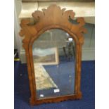 A GEORGE III MAHOGANY FRAMED WALL MIRROR with fretwork crest and original plate,