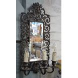 A CAST METAL GIRANDOLE with mask decoration and three sconces (electrified) 53cm