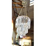 A 1920S CHANDELIER with cut glass droplets