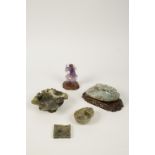 A GROUP OF SIX CARVED SOAPSTONE/GREENSTONE DISHES/PLAQUES and a figure, mainly C