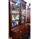 A 19TH CENTURY MAHOGANY LIBRARY BOOKCASE with glazed upper section, the based fi