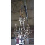 AN ITALIAN SILVER GILT SIX BRANCH CHANDELIER with glass lustres