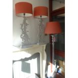 A PAIR OF CONTEMPORARY CARVED WOODEN TABLE LAMPS with grey distressed paint work