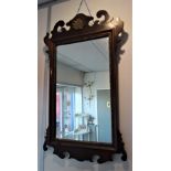 A GEORGE III STYLE MAHOGANY FRAMED WALL MIRROR, 48cm wide