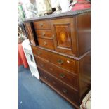 AN EDWARDIAN MAHOGANY AND INLAID CHEST OF DRAWERS, the upper section with an arr