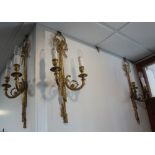 THREE BRASS WALL LIGHTS of classical style with ribbon tied decoration, 60cm hig