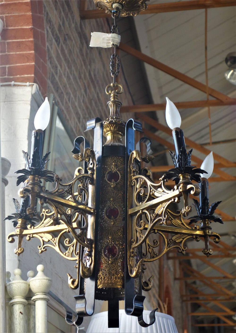 A CONTEMPORARY GOLD PAINTED EASTERN CEILING LIGHT FITTING with four scroll brack