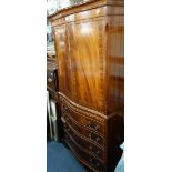 A REPRODUCTION DRINKS CABINET in the form of a small linen press, 72cm wide