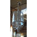 A HALL LANTERN of cylinder form, with glass shade and a mottled painted finish,