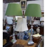 A PAIR OF SILVER GILT WOODEN TABLE LAMPS with green coloured shades