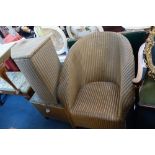 A LLOYD LOOM LAUNDRY BASKET, a similar stool, an armchair, a card table and an o