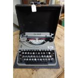 A VINTAGE 'OLIVER' PORTABLE TYPEWRITER in rexine covered case