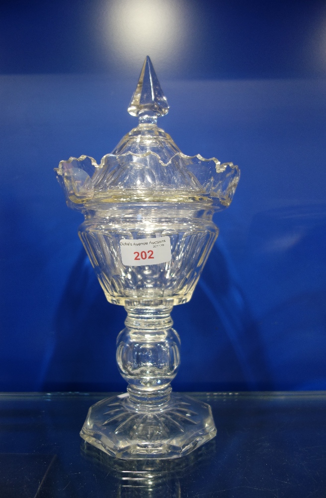 A VICTORIAN CUT GLASS PEDESTAL BONBON BON JAR, the lid with a central spike, 32cm high (overall)