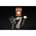 A LADIES SILVER OPEN FACED POCKET WATCH in a fitted travelling case, a silver fob chain and one