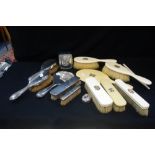 A COLLECTION OF SILVER BACKED DRESSING TABLE BRUSHES, to include a silver backed dressing table hand