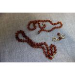 TWO AMBER STYLE NECKLACES and a pair of earrings (3)